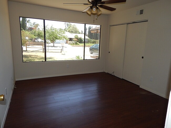 Building Photo - This property is a 3 bedroom, 2 bathroom home featuring an open floor plan with tile throughout. ...