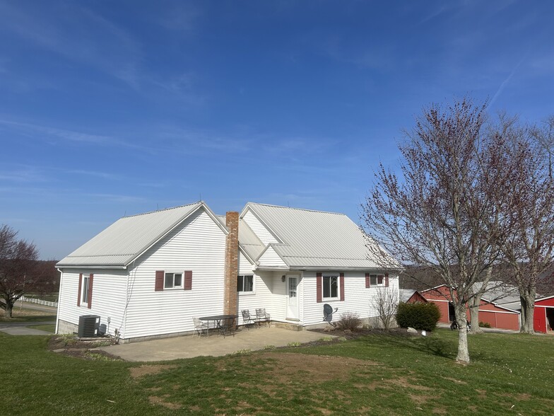 Back of house with nice patio and landscaping. - 203 Reibold Rd