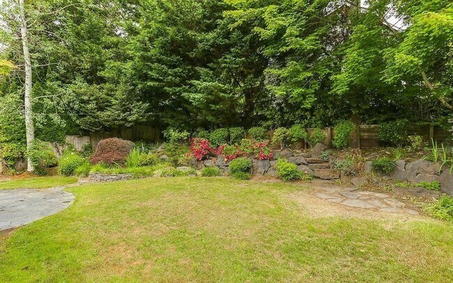 Building Photo - Spacious Four-Bedroom Home with Gourmet Kitchen, Multiple Living Areas, Loft, and Beautifully Lan...