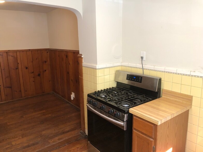 Kitchen with private rear entrance - 1711 Portman Ave