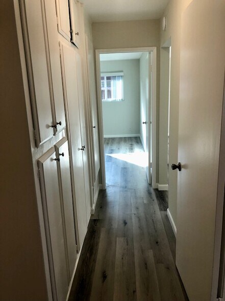 Hallway with Closets to Main Bedroom - 16181 Ganges Lane #2, Huntington Beach, CA 92647