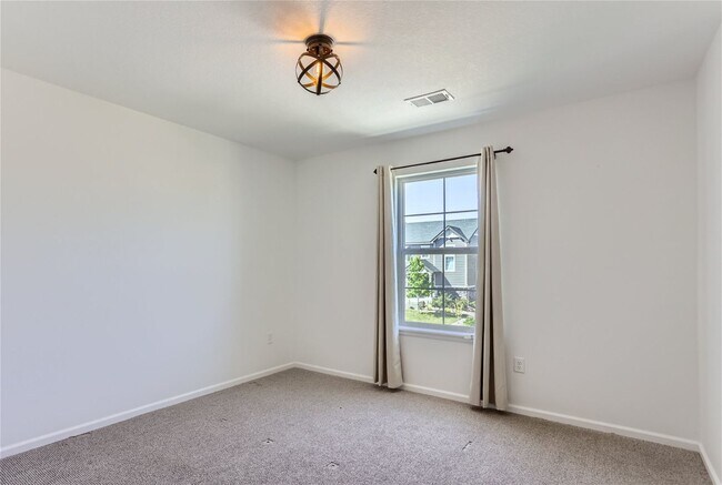 Building Photo - 3-Bedroom Home with Open Floor Plan, Private Balcony & Attached Garage