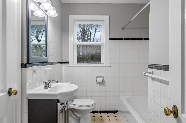 Building Photo - Brick home, Two Story, Hardwoods, DR, 2 Sun Rooms, FP, Carport!.