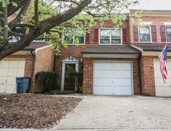 Building Photo - Beautiful brick townhome featuring three f...