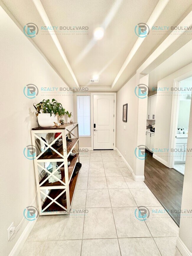 Building Photo - Welcome to your dream home, where modern elegance meets unparalleled convenience!