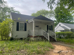 Building Photo - Updated spacious 5-bed with a fenced-in yard!