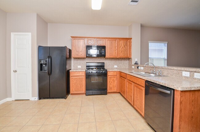 Building Photo - 10806 Woodwind Shadows Dr