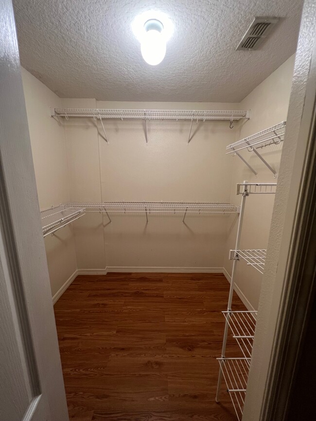 master bedroom walk in closet - 2488 Tremont Dr