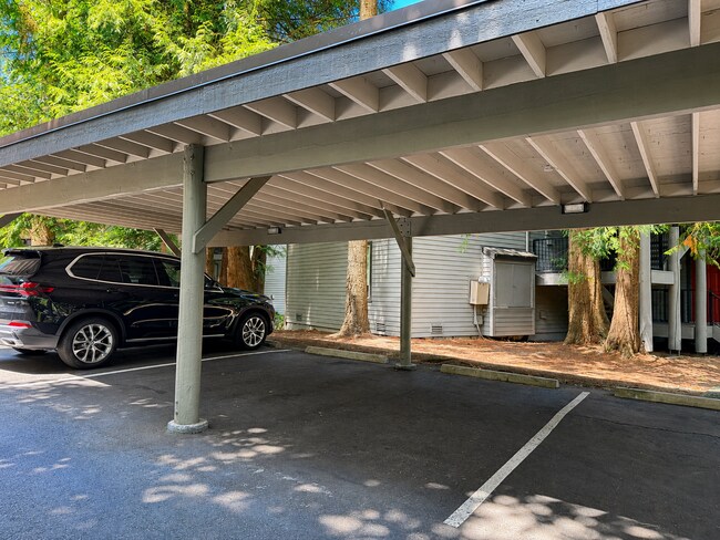 Building Photo - Modern Wooded Condo with Upgraded Kitchen & Private Deck