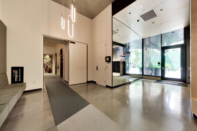 Building Photo - Urban Luxury at SoMa Serif Condos 2BR/2BA | In-Unit Laundry & 24-Hour Security