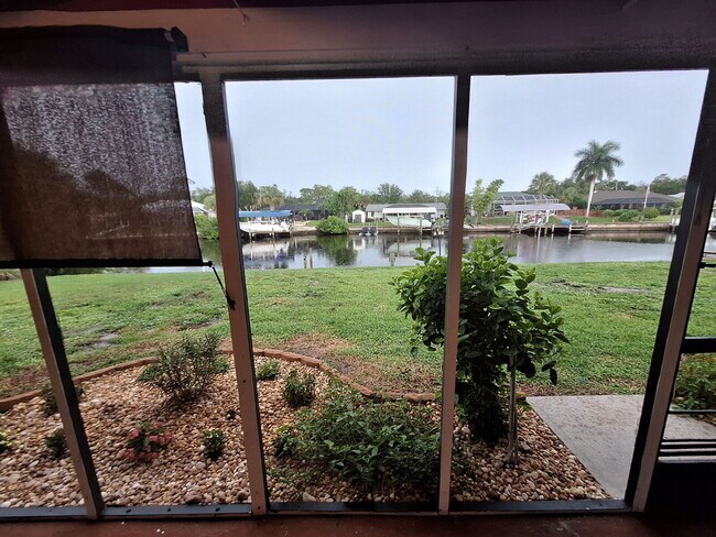 Building Photo - Gulf Access Home on Canal Available Now