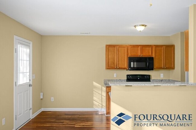 Building Photo - Charming 3-Bedroom Townhome with First-Floor Suite & Off-Street Parking – Near Capital Blvd & I-440