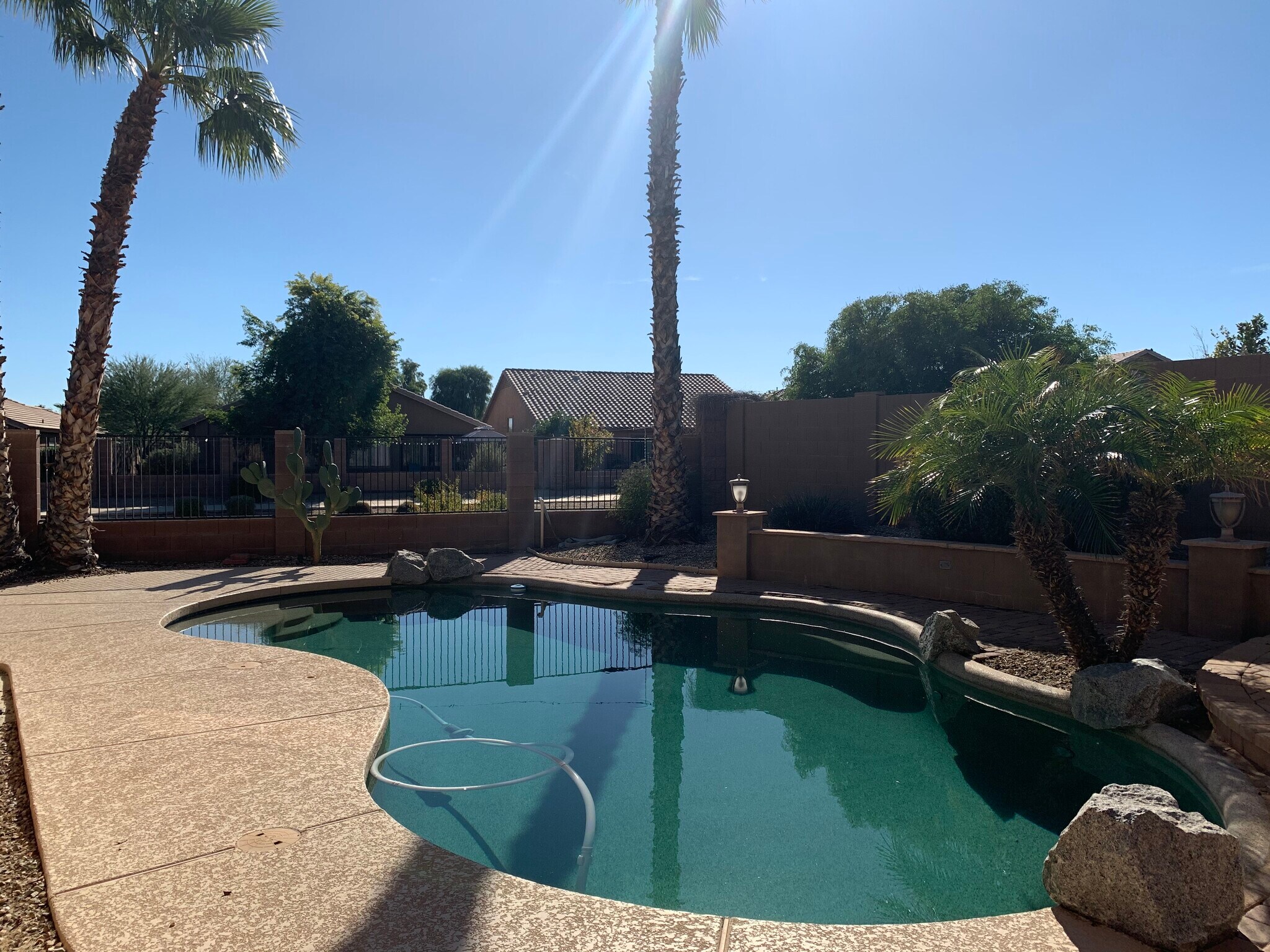 Spacious 4-bedroom, 2-bath home with soaring ceilings, gourmet kitchen, and a heated self-cleaning p - 16426 N 152nd Ln