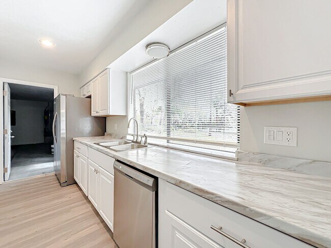 Building Photo - Stunning Waterfront Home located in the de...