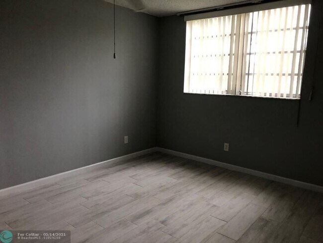 Building Photo - 6050 NW 64th Ave