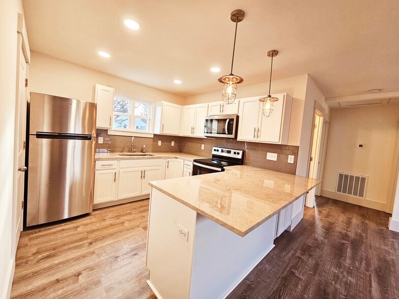 Kitchen with refrigerator and ice maker, dishwasher, microwave and oven. - 1219 N 7th St