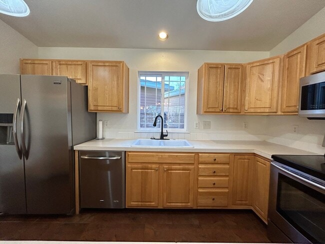 Building Photo - Stylish, Spacious 3 Bedroom Townhome with Two-Car Garage