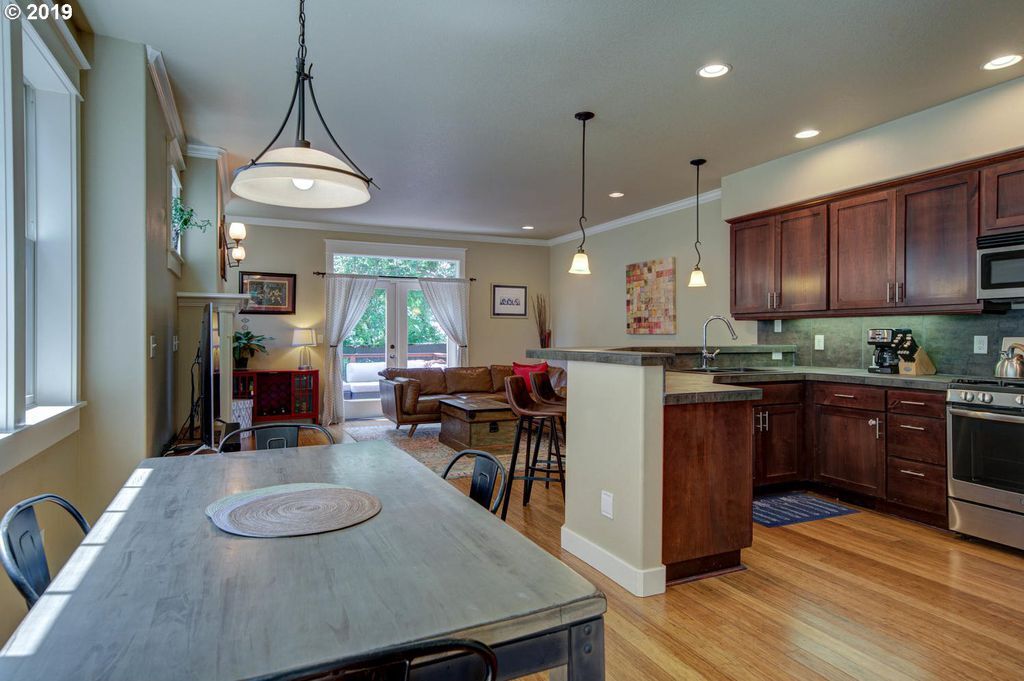 Dining, Kitchen, Living Furnished - 7921 N Denver Avenue