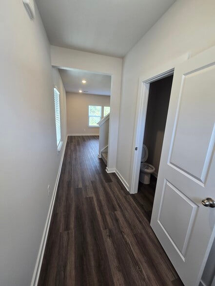 Entrance hallway w/half bath - 3901 Northbrook Dr