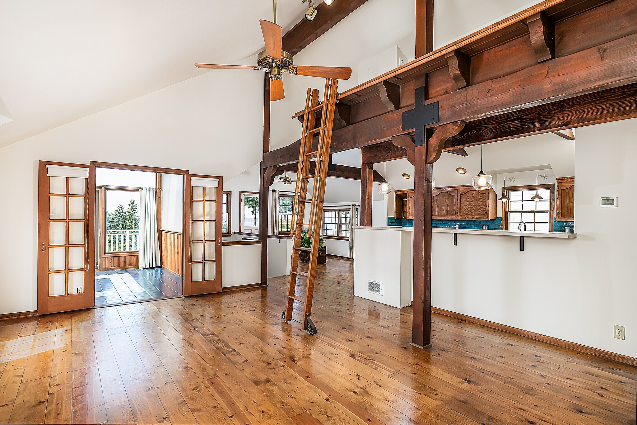 Large living room open to kitchen with terrace and sunroom - 22224 98th Ave W