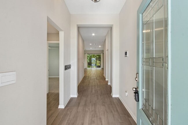 Building Photo - Modern 4BR Home with 3 Full Baths in River Glen | Screened Porch & Resort-Style Amenities