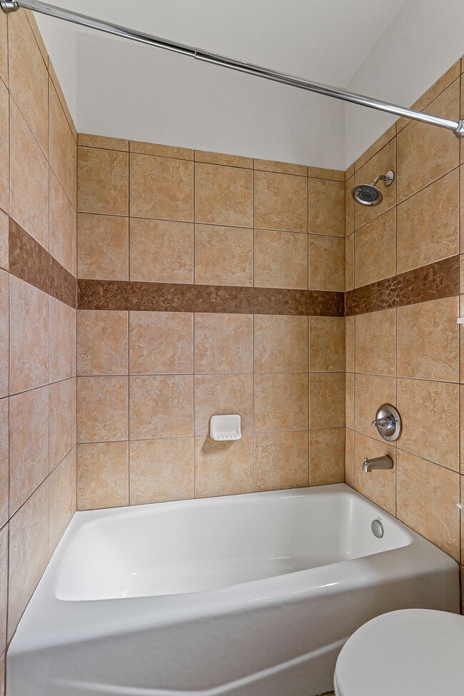 Building Photo - "Spacious 4-Bed Oasis with Granite Touches...
