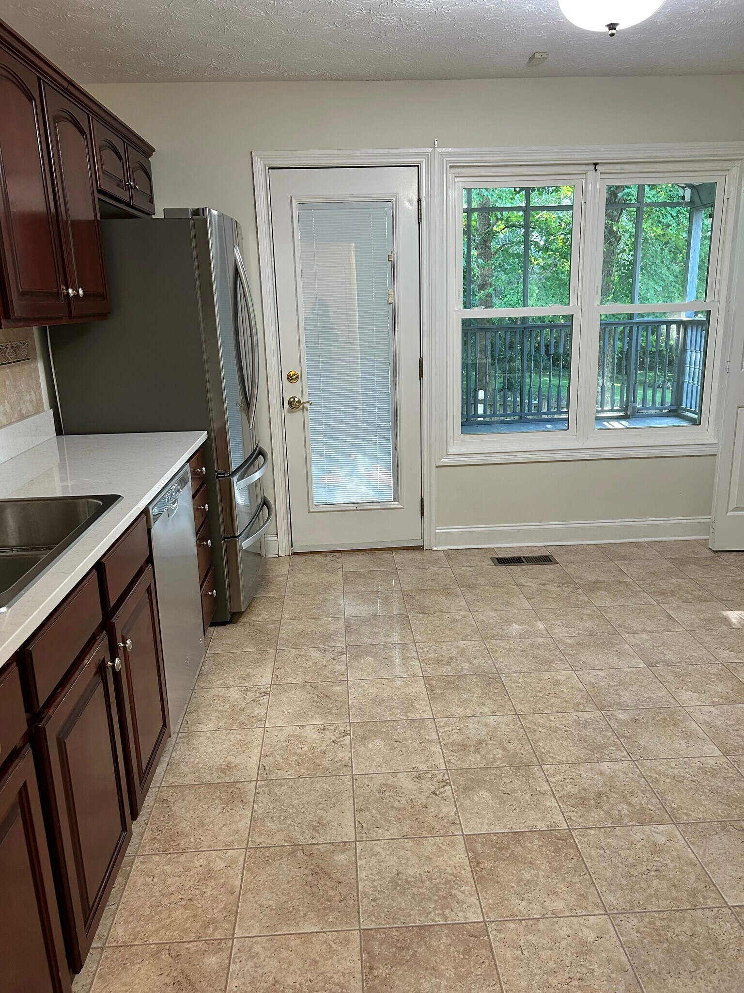 Kitchen looking out to porch - 13051 Sanderling Ln