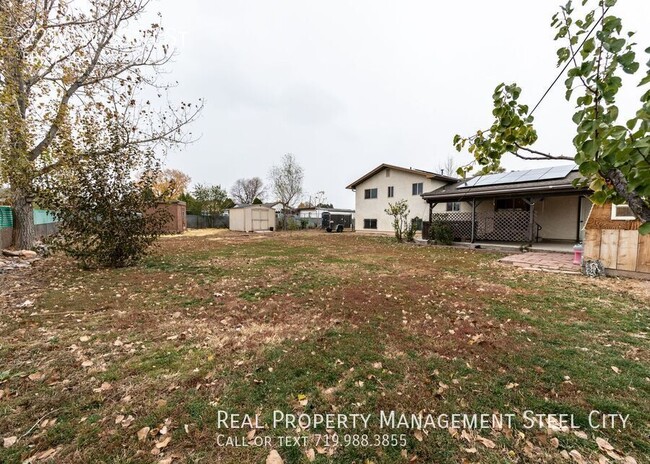 Building Photo - Spacious 5-Bedroom Home with Solar Panels ...