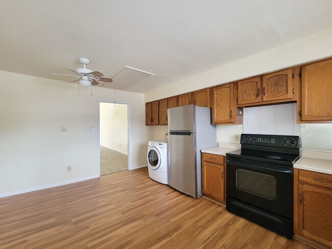 Building Photo - This stunning single-story upstairs unit o...