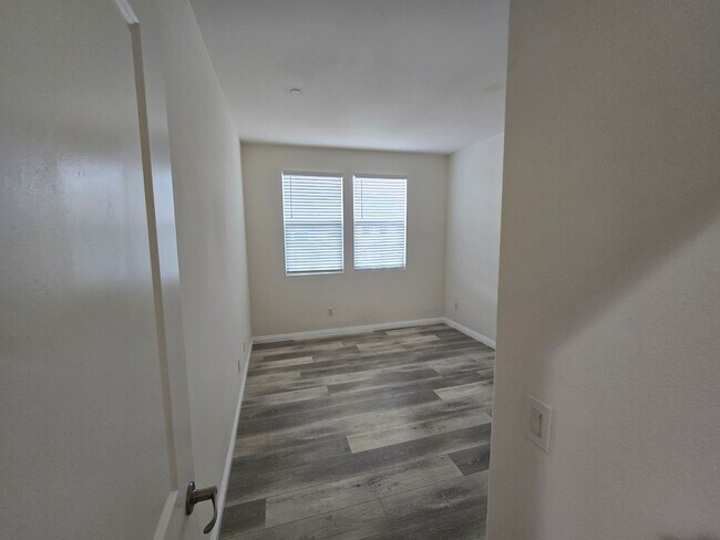 Building Photo - Open-Concept Living with Downstairs Bedroom & Enclosed Patio Retreat