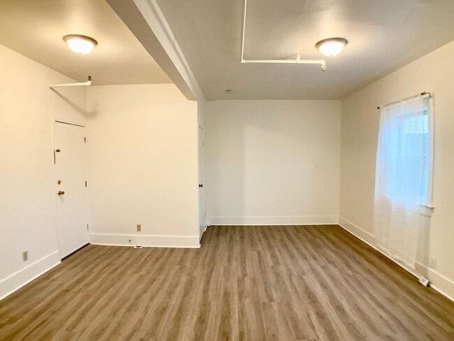 Building Photo - RENOVATED and Private. DISHWASHER, ON-SITE LAUNDRY, HARDWOOD!