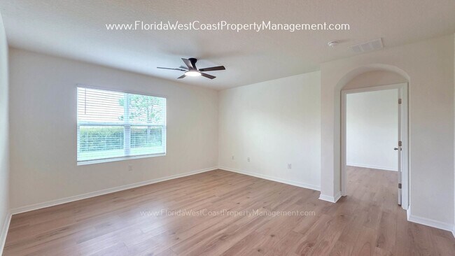 Building Photo - MOVE IN READY ! 4 BEDROOM/2 BATH! TILE- LVP THROUGHOUT! LAWN MOWING INCLUDED!
