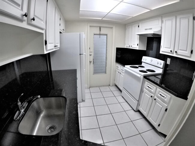 Black granite countertop - 9390 E Bay Harbor Dr