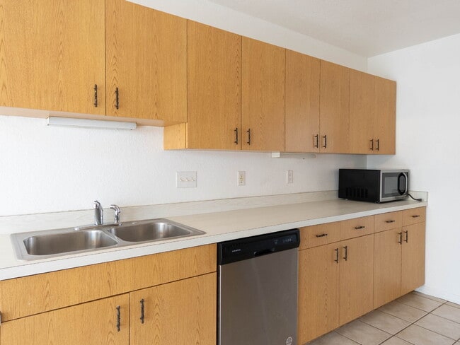 Building Photo - Recently painted 4BR/3BA home with tile floors throughout, fenced yard, detached garage, and prim...