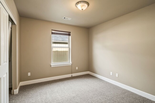 Building Photo - Spacious 4-Bedroom Home with New Paint & Carpet, Fenced Yard