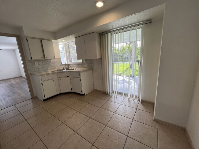 Building Photo - ** Single Family Home - Port Charlotte - 2 Bed / 2 Bath Plus Den/Bonus Room - Annual Rental - $16...