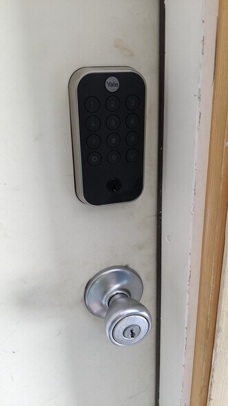 Exterior of rear entry door showcasing Yale pincode lock - 29 Woodbine St