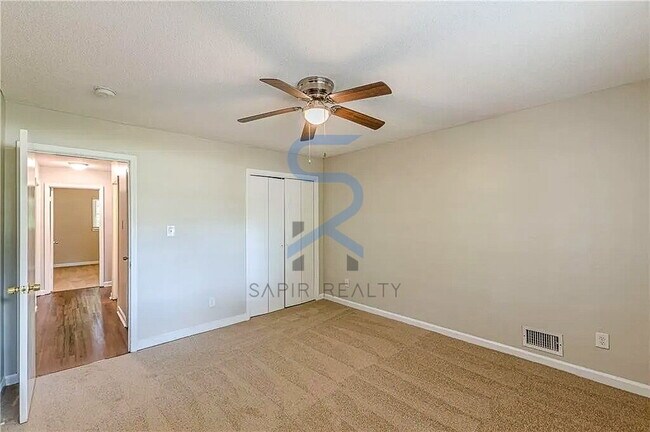 Building Photo - Move in before December 31st and choose your reward: a $250 Amazon Gift Card or a 55" Smart TV!