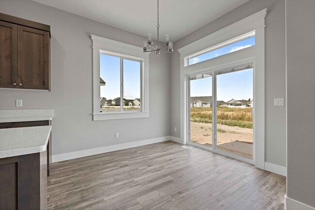 Building Photo - NEW HOME with large garage stalls and unfinished basement for additional storage