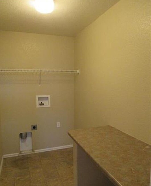 Laundry room upper level. - 7334 Pearly Heath Rd