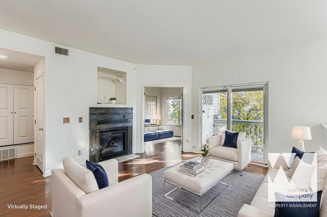 Building Photo - Light-Filled Corner Condo with Garage + Reserved Parking in Gated Community