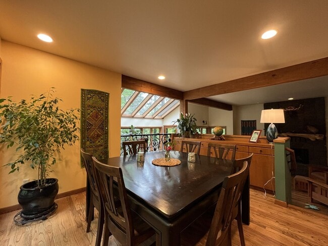 Building Photo - One-of-a-Kind Custom Home with Wall of Windows, Stone Fireplaces, Expansive Entertainment Space &...