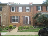 Building Photo - SPACIOUS BRICK TOWN-HOME