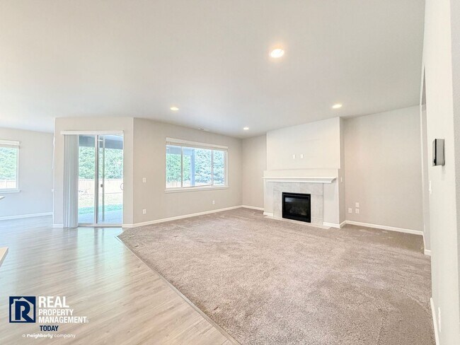 Building Photo - Easy JBLM Commute Like-New 4BR Home with 3-Car Garage & Bonus Office