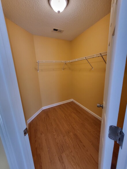 Large walk In closet in primary bedroom - 4910 Windsor Green Way