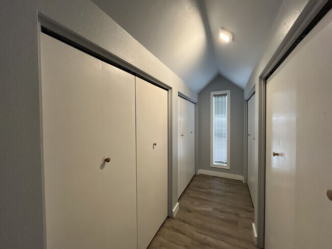 Building Photo - Three-Bedroom Home with Updated Kitchen & Vaulted Ceilings, large open basement, Hardwood floors