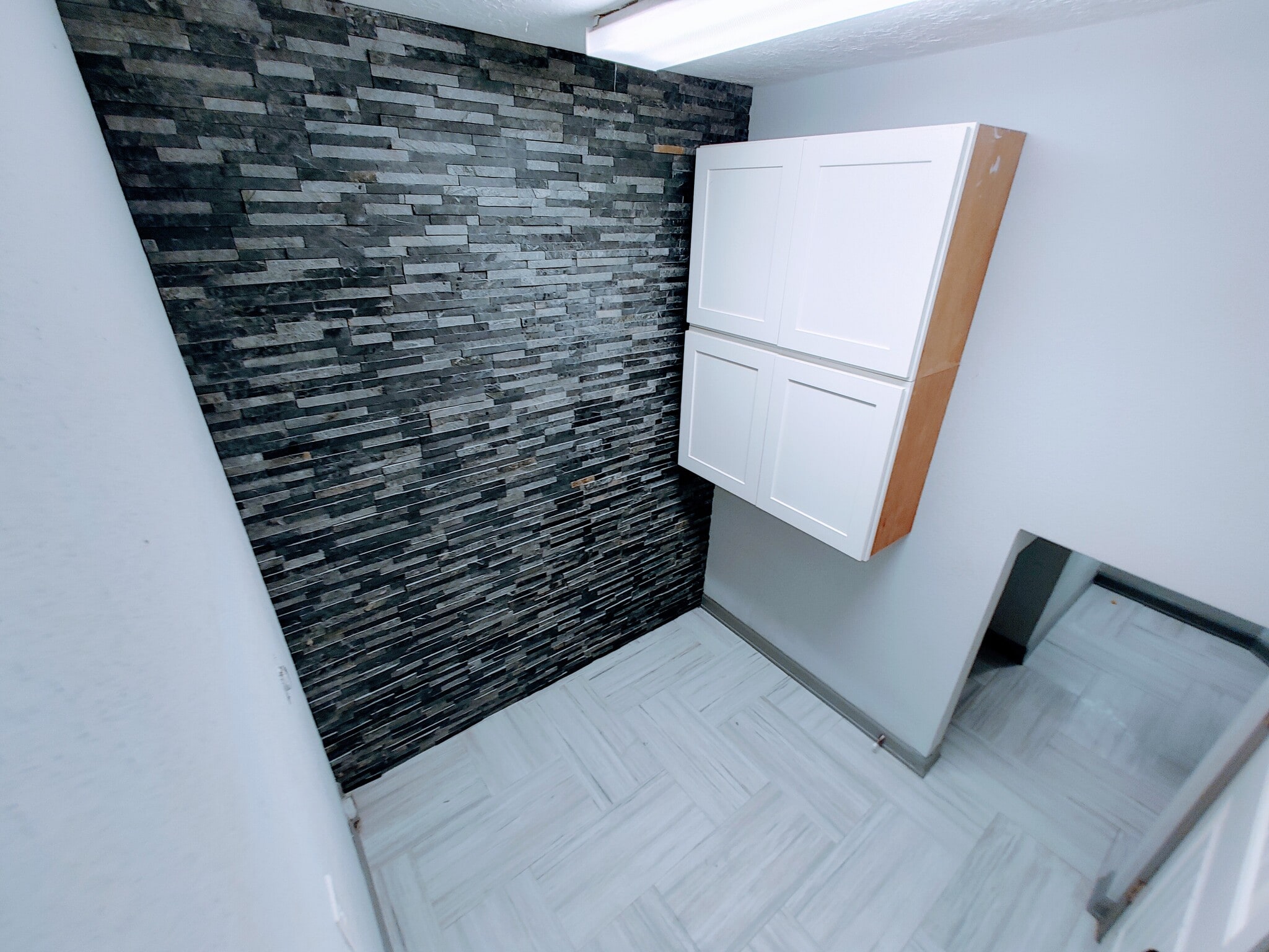 Washroom with stacked stone wall and large storage closet - 2 Arnica Ct