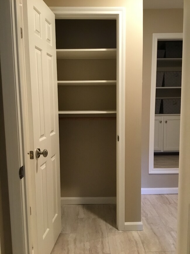 Linen closet with clothes rod - 1103 Dulles Ave