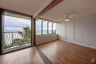 Building Photo - BEACH FRONT Partly Furnished 2/2/1 cov pkg...