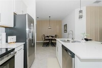 Building Photo - 15275 Green Acre Avenue Unit 338